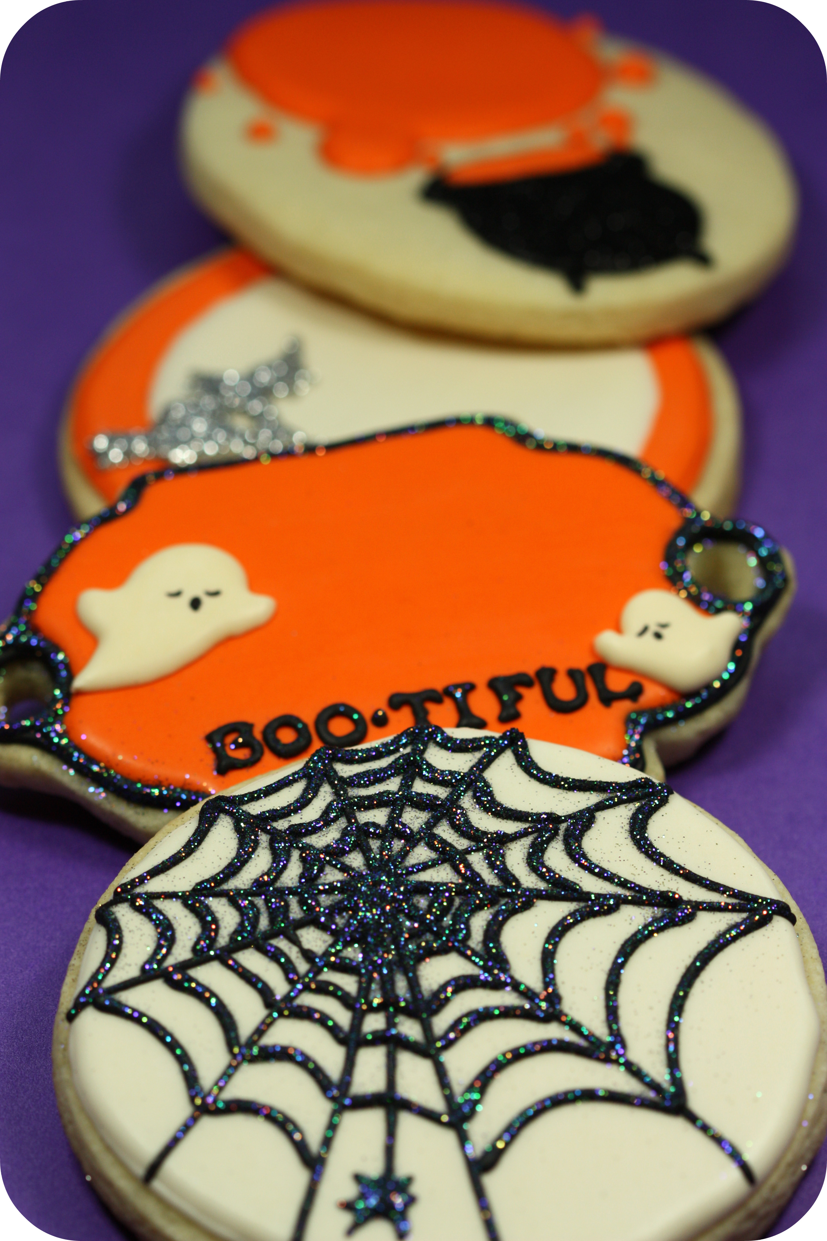 Halloween decorated cookies spiderweb ghost cauldron