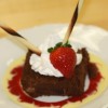 plated dessert brownie whip cream strawberry chocolate cigarellos