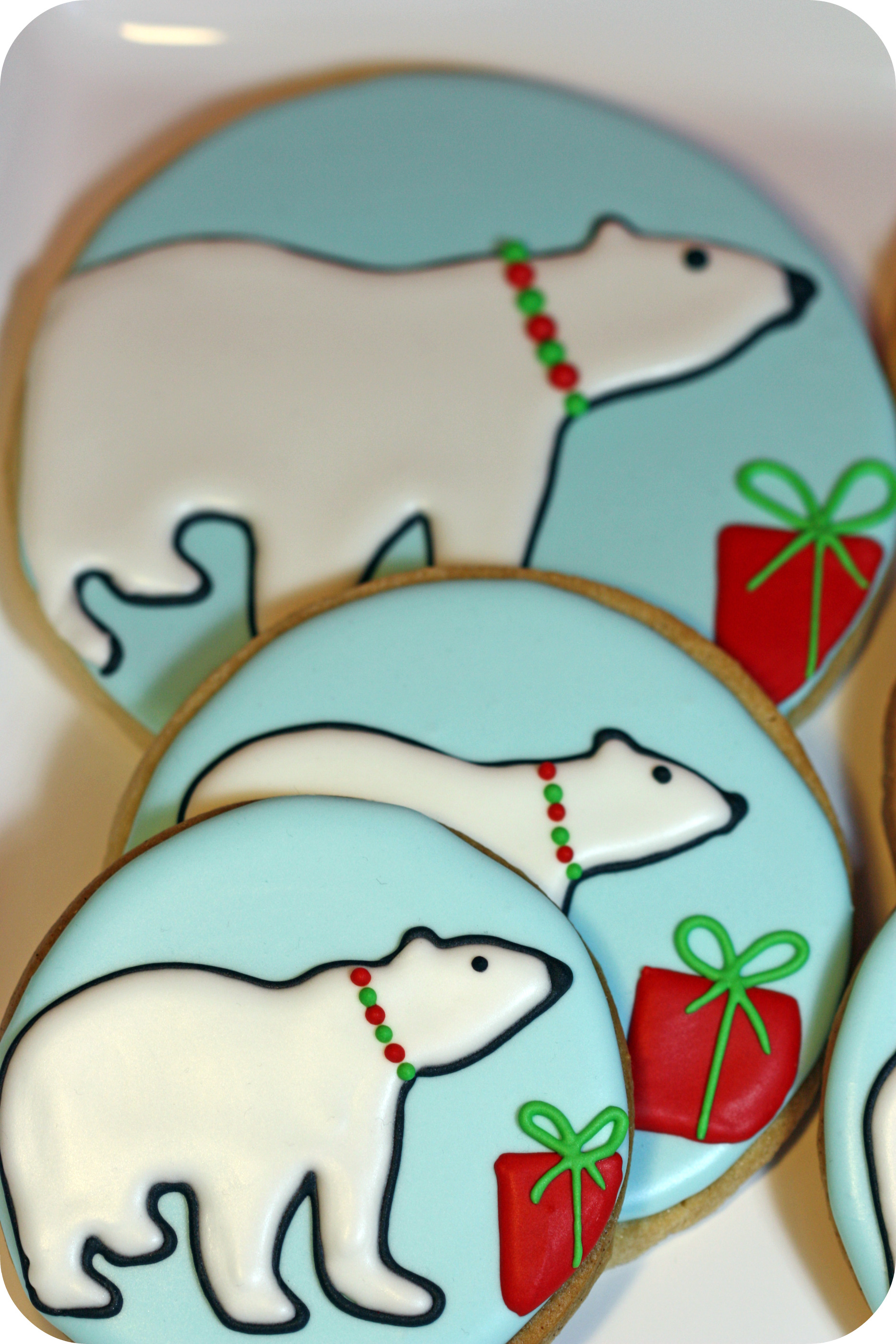 polar bear sugar cookies on a cake stand